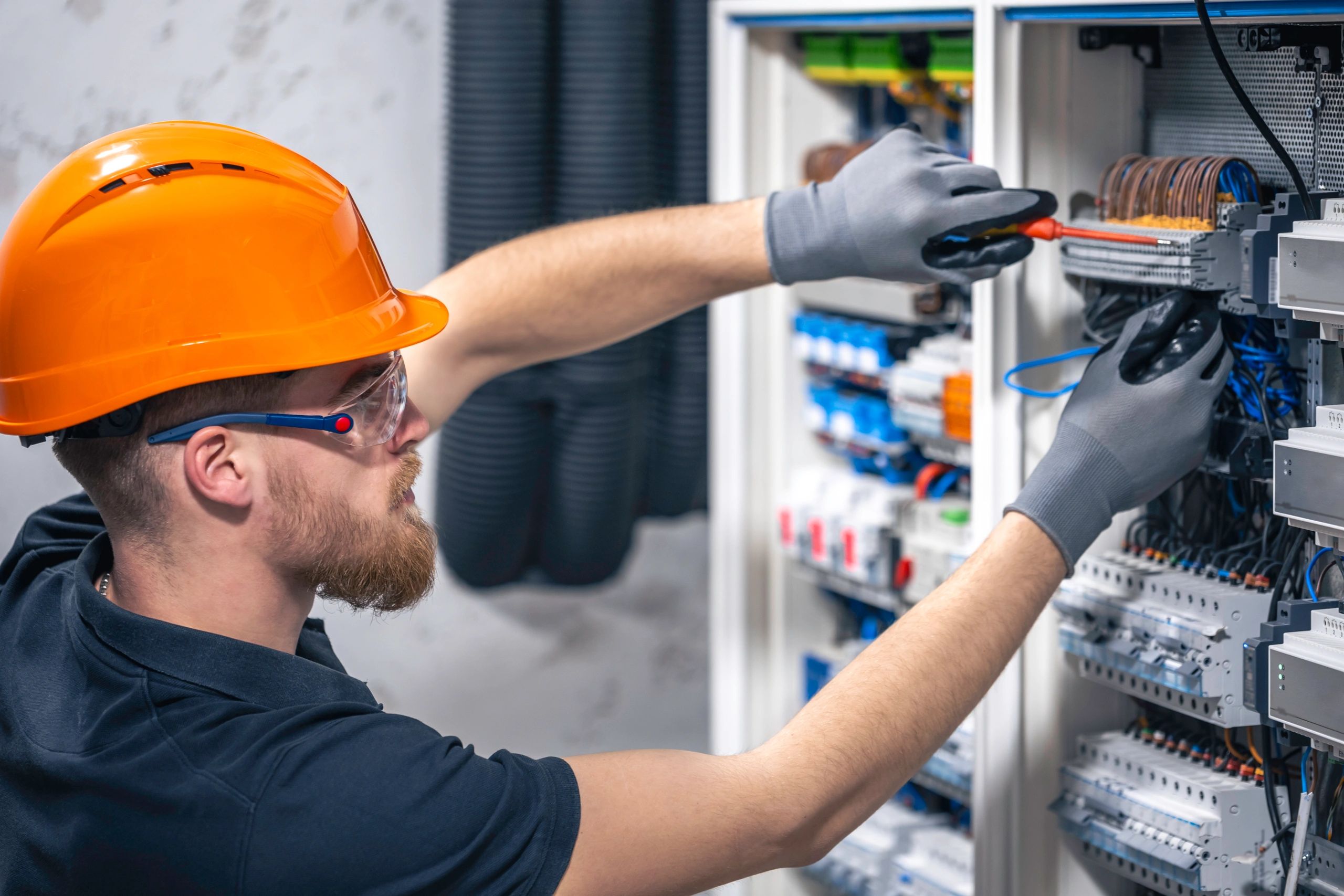 Electrician installing commercial lighting